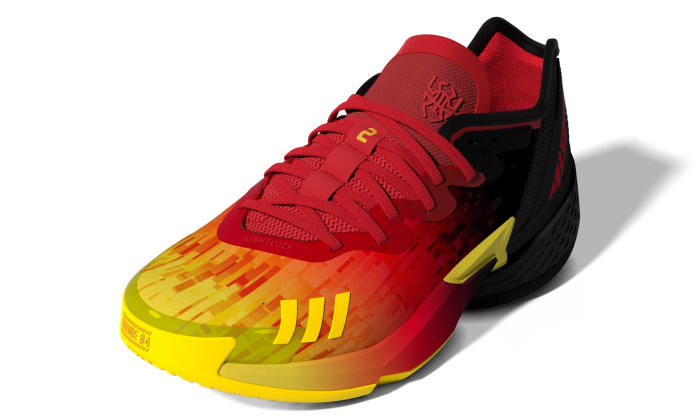 Red, black and yellow Donovan Mitchell shoes.