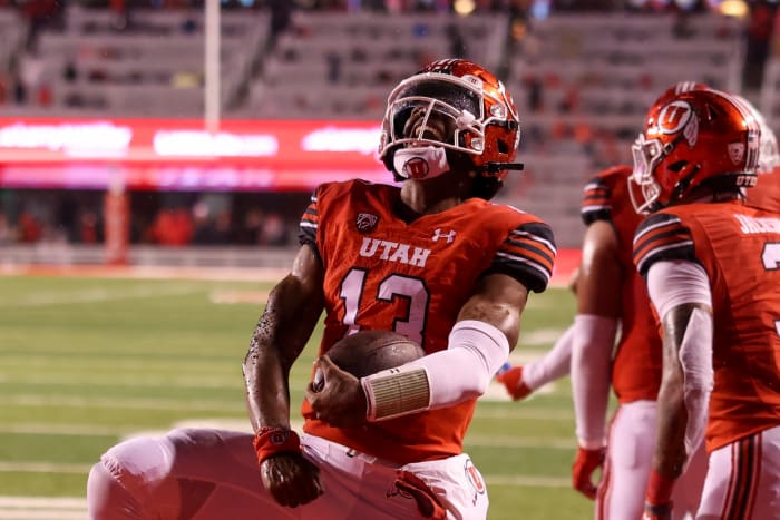 Utah Utes quarterback Nate Johnson (13) celebrates a touchdown against the Arizona Wildcats in the second quarter at Rice-Eccles Stadium.