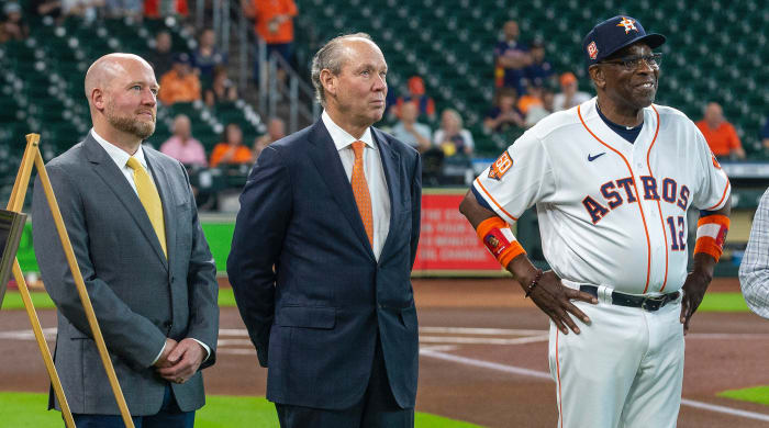 Astros GM James Click, left, with team owner Jim Crane, center, and manager Dusty Baker.