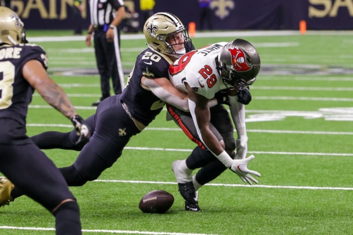 New Orleans Saints linebacker Pete Werner (20) breaks up a pass to the Tampa Bay Buccaneers running back Rachaad White (29).  Mandatory Credit: Stephen Lew-USA TODAY Sports