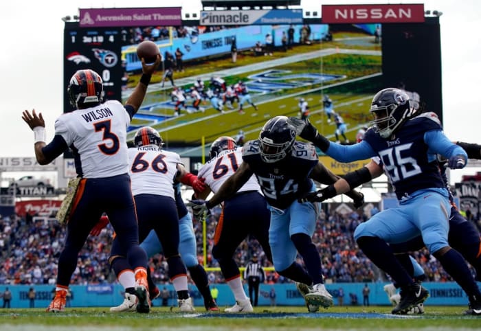 Denver Broncos quarterback Russell Wilson (3) is under pressure from the Titans' defense in the first quarter at Nissan Stadium.