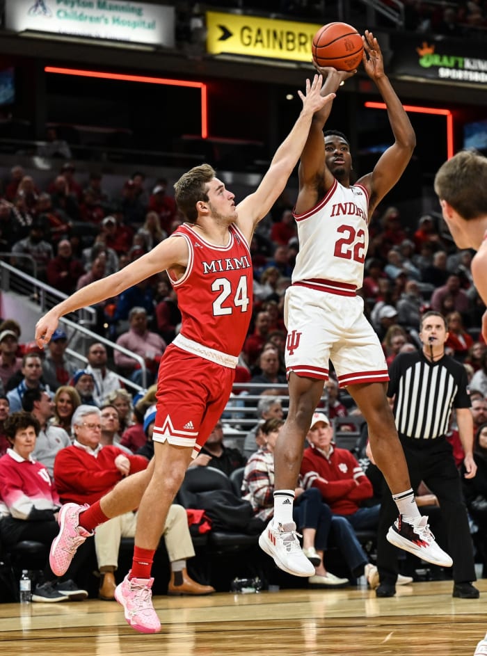 Indiana forward Jordan Geronimo (22) puts the ball high over Miami guard Eli Yofan (24) in the second half of Sunday's Hoosier Classic (USA TODAY Sports).