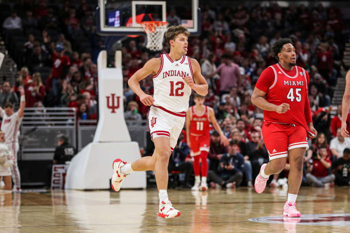 Miller Kopp waves his tongue while running forward after hitting a three-pointer at Gainbridge Fieldhouse in Indianapolis on Sunday.  (Photo courtesy of IU Athletics)