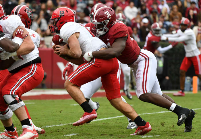 11/19/2022;  Tuscaloosa, Alabama, USA;  Austin Peay quarterback Mike DiLiello (12) is tackled by Alabama linebacker Will Anderson Jr. (31) at Bryant-Denny Stadium.  Mandatory Credit: Gary Cosby Jr.-USA TODAY Sports