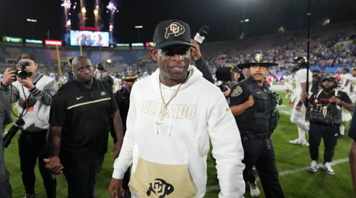 Colorado coach Deion Sanders leaves the field at the Rose Bowl after a loss to UCLA.