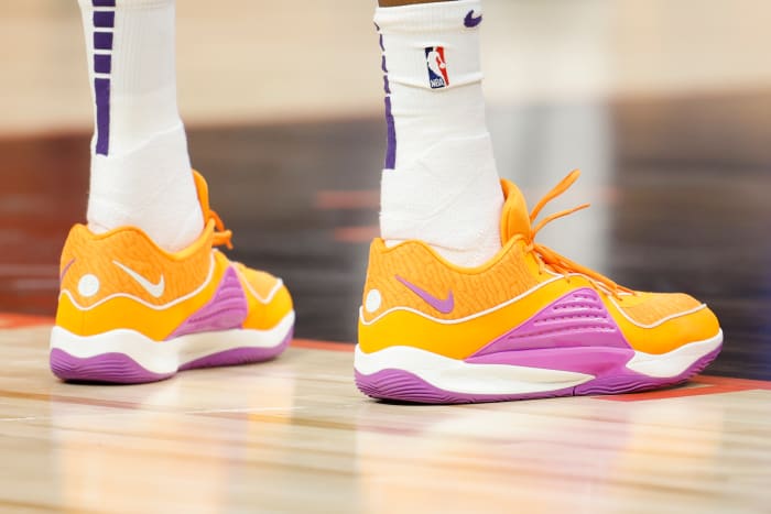 Phoenix Suns forward Kevin Durant's orange and purple Nike sneakers.
