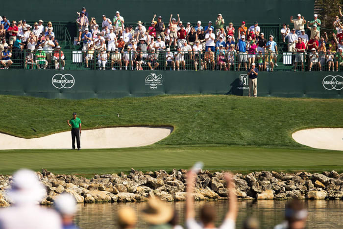 Tiger Woods celebrates a birdie on the 18th hole at Bay Hill in 2011.