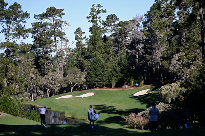 Si Woo Kim plays a shot from the drop zone on the 12th hole in 2021 at Spyglass Hill.