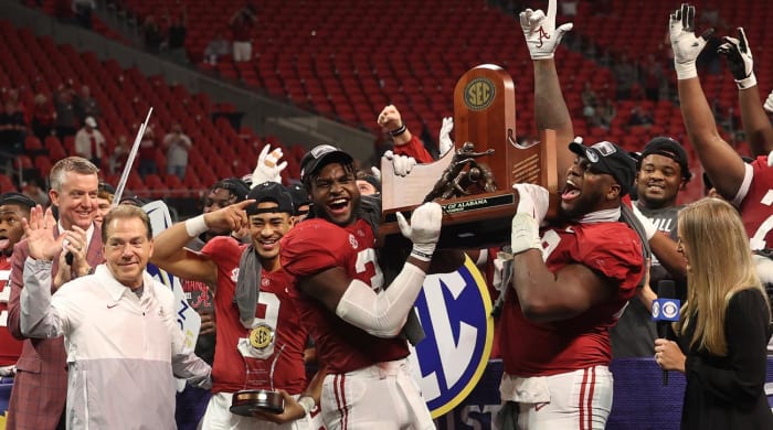 December 4, 2021;  Atlanta, GA, United States;  Alabama Crimson Tide head coach Nick Saban, left, quarterback Bryce Young (9), linebacker Will Anderson Jr. (31) and defensive lineman Phidarian Mathis (48) celebrate with the LA championship trophy. SEC after their win against the Georgia Bulldogs at Mercedes.  Benz Stadium.  Mandatory Credit: Jason Getz-USA TODAY Sports
