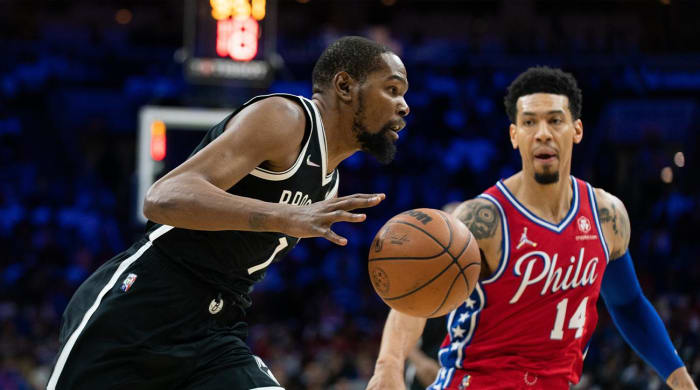 October 22, 2021;  Philadelphia, Pennsylvania, United States;  Brooklyn Nets forward Kevin Durant (7) drives off Philadelphia 76ers forward Danny Green (14) during the first quarter at the Wells Fargo Center.