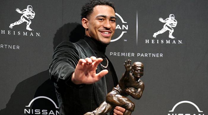 Dec 11, 2021; New York, NY, USA; 2021 Heisman winner Alabama quarterback Bryce Young poses for pictures with the trophy during a press conference at the New York Marriott Marquis in New York City. Mandatory Credit: Brad Penner-USA TODAY Sports