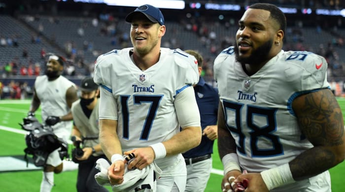 Tennessee Titans quarterback Ryan Tannehill (17) and defensive end Jeffery Simmons (98) celebrate their victory over the Houston Texans in an NFL football game on Sunday, January 9, 2022, in Houston.