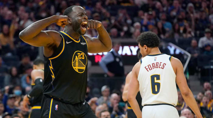 Golden State Warriors forward Draymond Green celebrates after scoring against the Denver Nuggets during the second half of Game 1 of an NBA basketball first-round playoff series in San Francisco, Saturday, April 16, 2022.