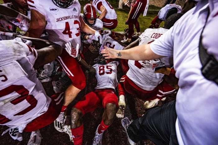 Jacksonville State receiver Damond Philyaw-Johnson is at the bottom of a celebratory dogpile.