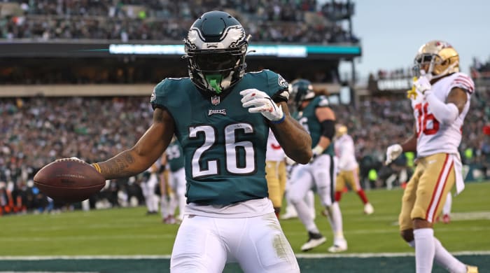 January 29, 2023;  Philadelphia, Pennsylvania, USA;  Philadelphia Eagles running back Miles Sanders (26) scores a touchdown against the San Francisco 49ers in the second quarter of the NFC Championship game at Lincoln Financial Field.