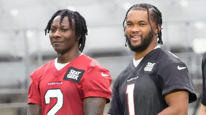 August 8, 2022;  Glendale, Arizona, US;  Arizona Cardinals wide receiver Marquis Brown (2) and quarterback Kyler Murray (1) watch during training camp at State Farm Stadium.