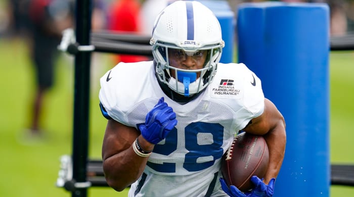 Indianapolis Colts running back Jonathan Taylor (28) runs a drill during practice at the NFL team's football training camp in Westfield, Ind., Tuesday, Aug.  2, 2022.