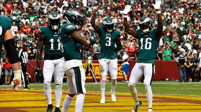 25 September 2022;  Landover, Maryland, USA;  DeVonta Smith (6), the Philadelphia Eagles wide receiver, celebrates with his teammates after scoring against the Washington captains during the second quarter at FedExField.