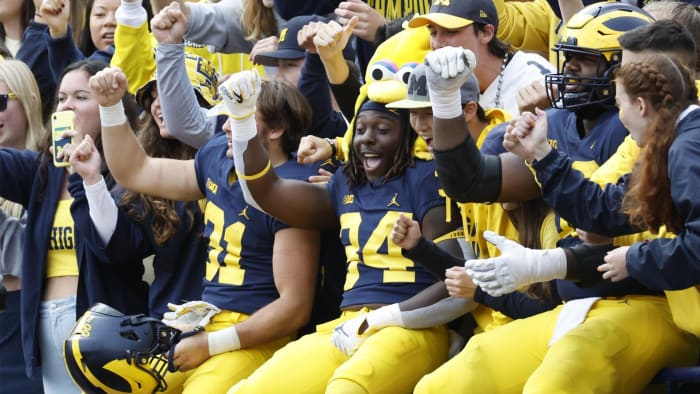 September 24, 2022; Ann Arbor, Michigan, USA. Players of the Michigan Wolverines celebrate in the student section after a game against the Maryland Terrapins at Michigan Stadium. Required Credit: Rick Osentoski-USA TODAY Sports