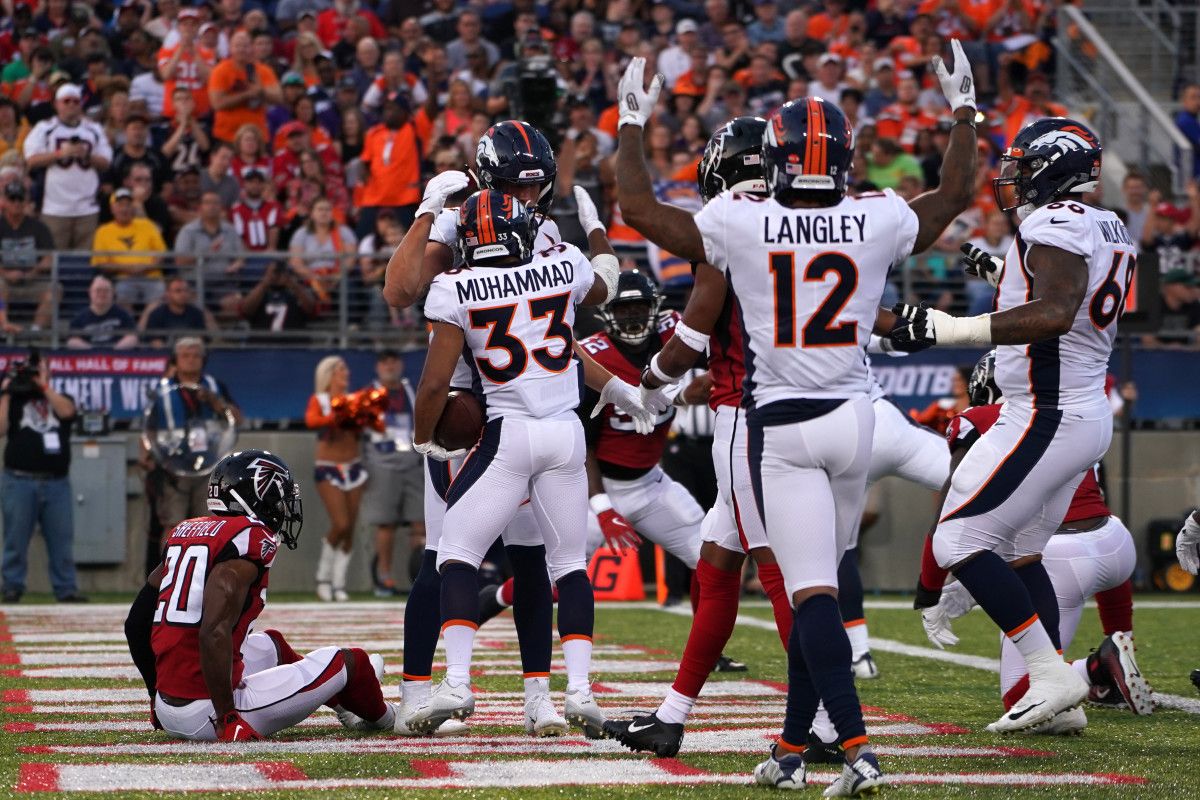 Broncos RB Khalfani Muhammad celebrates his first-quarter TD vs. Atlanta.