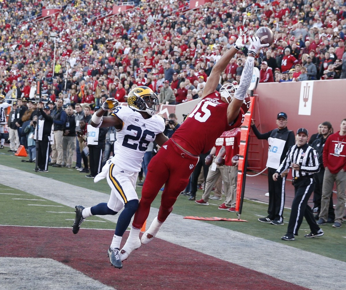 Michael Westbrook reaches up to catch a pass against Michigan.