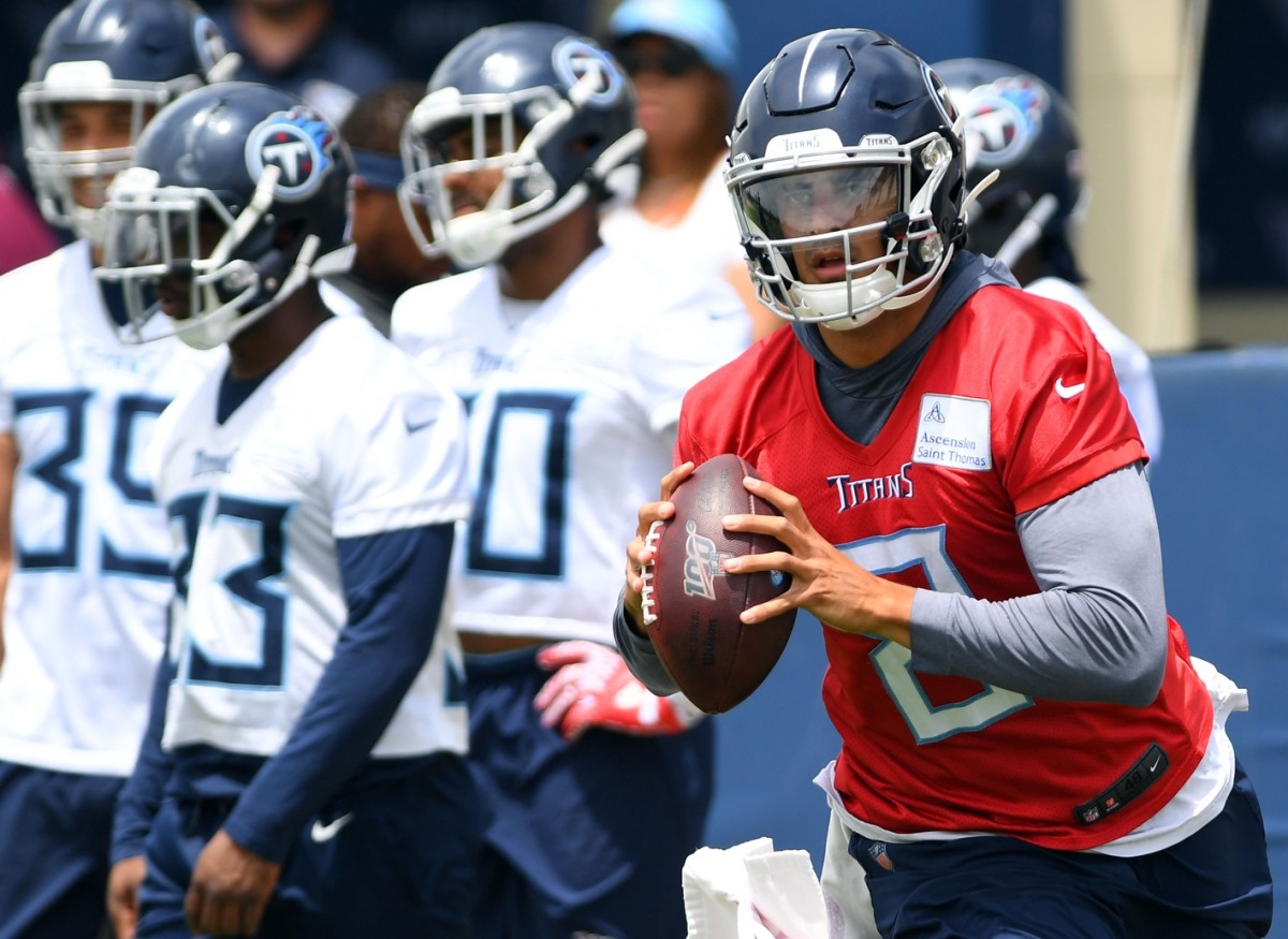 Marcus Mariota rolls out during a Tennessee Titans training camp workout