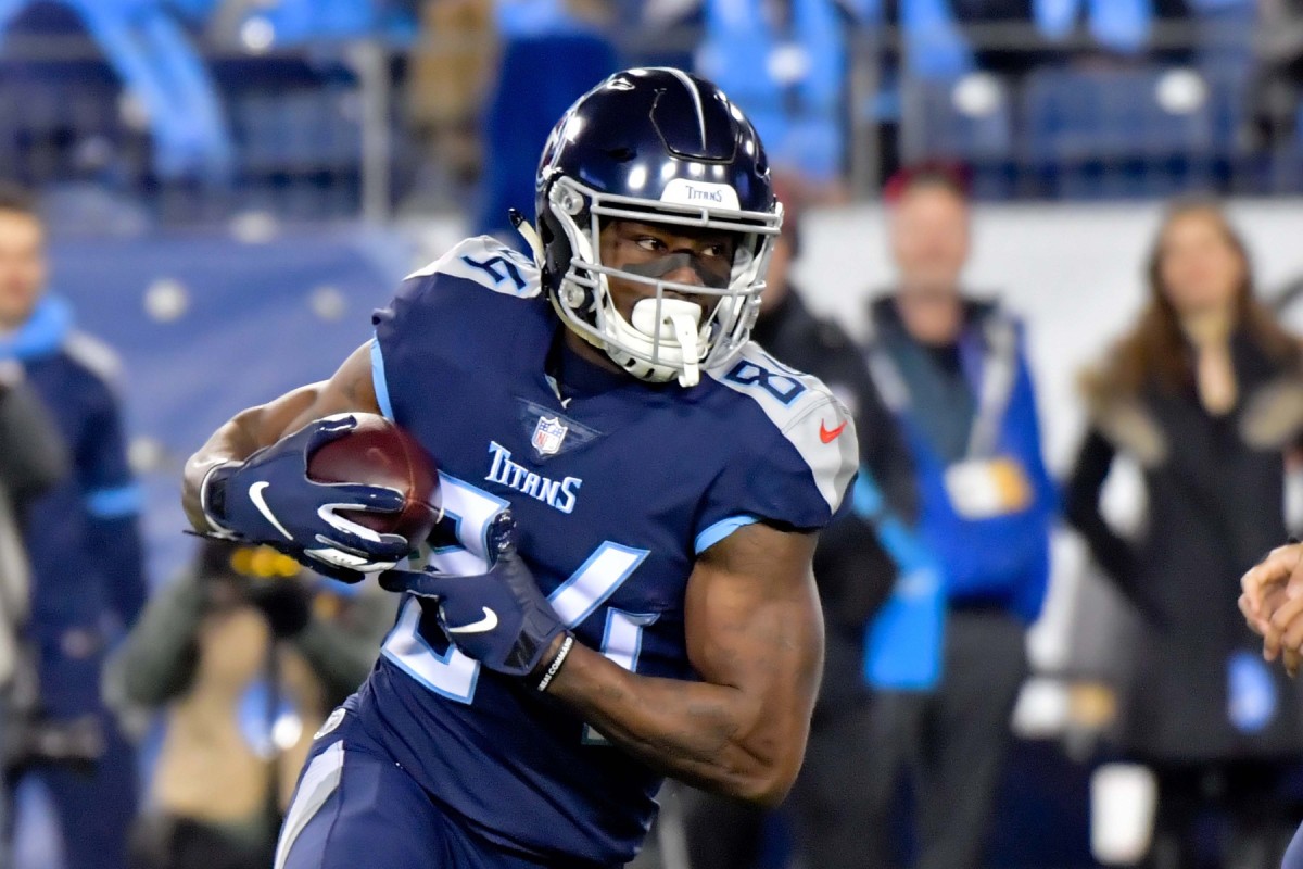 Tennessee Titans wide receiver Corey Davis runs with the ball