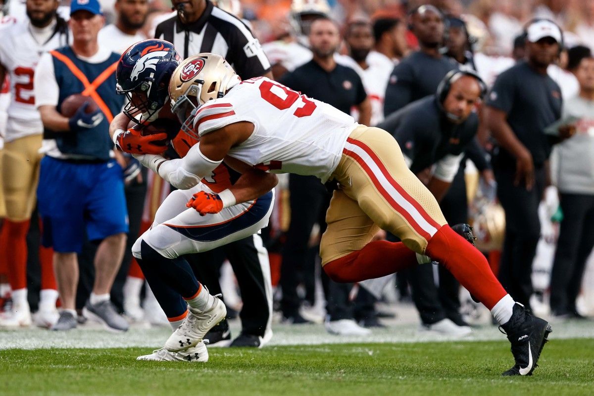 San Francisco 49ers defensive end Solomon Thomas (94) tackles Denver Broncos tight end Troy Fumagalli (84) in the second quarter at Broncos Stadium at Mile High.