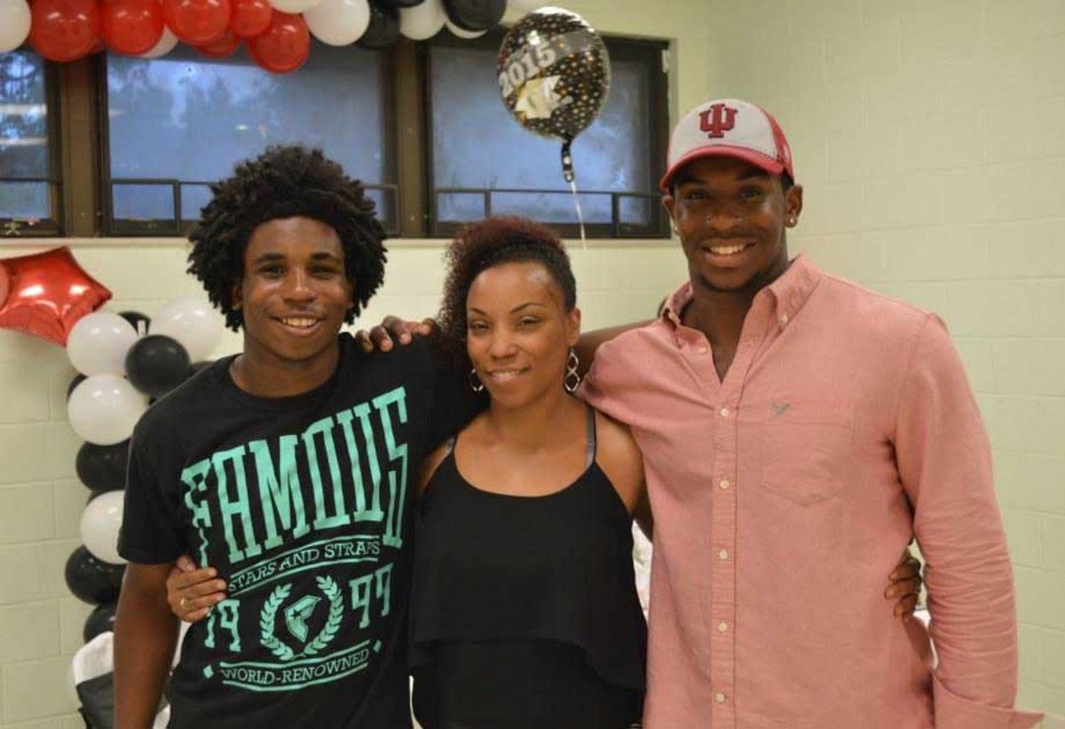 Tanya Broxton celebrates with family at Raekwon Jones' high school graduation party.
