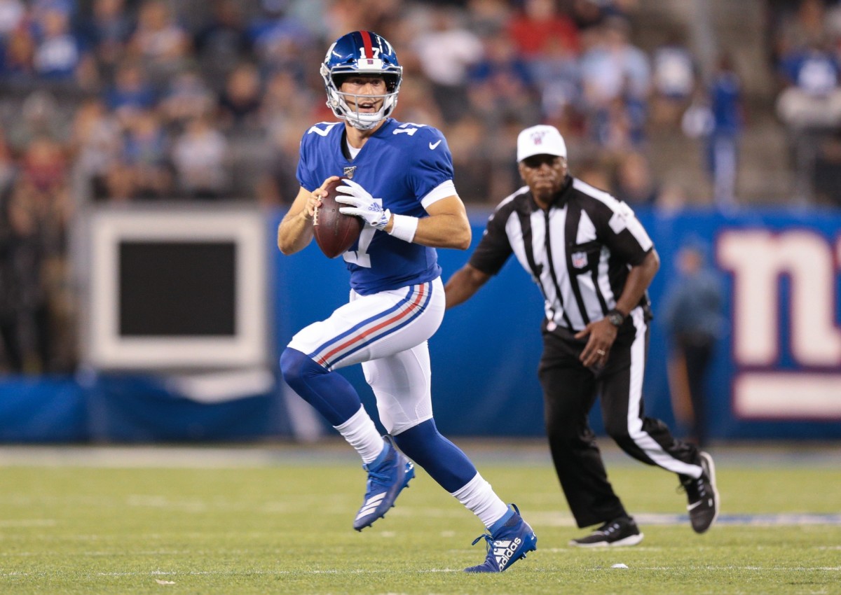 New York Giants quarterback Kyle Lauletta (17) rolls out during the second half against the Chicago Bears at MetLife Stadium.