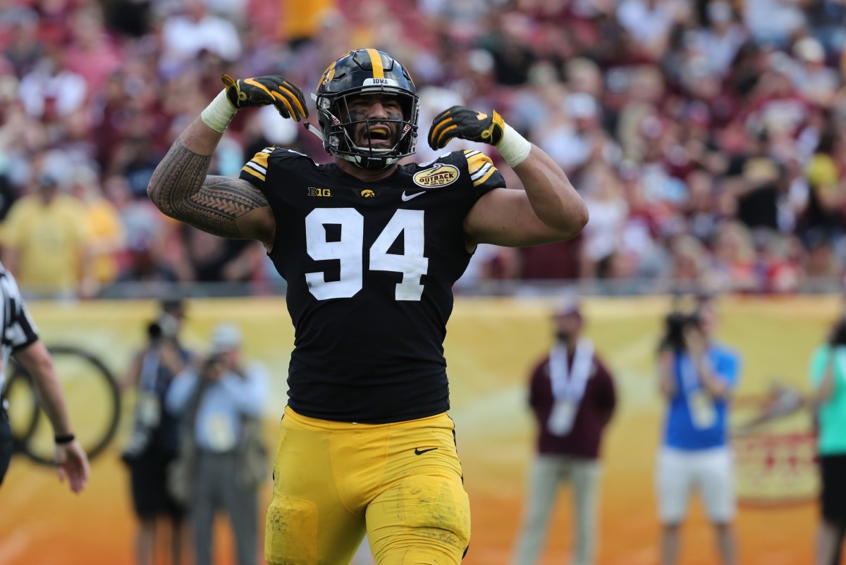 Iowa Hawkeyes defensive end A.J. Epenesa (94) reacts after a force to fumble the ball against the Mississippi State Bulldogs during the second quarter in the 2019 Outback Bowl at Raymond James Stadium.
