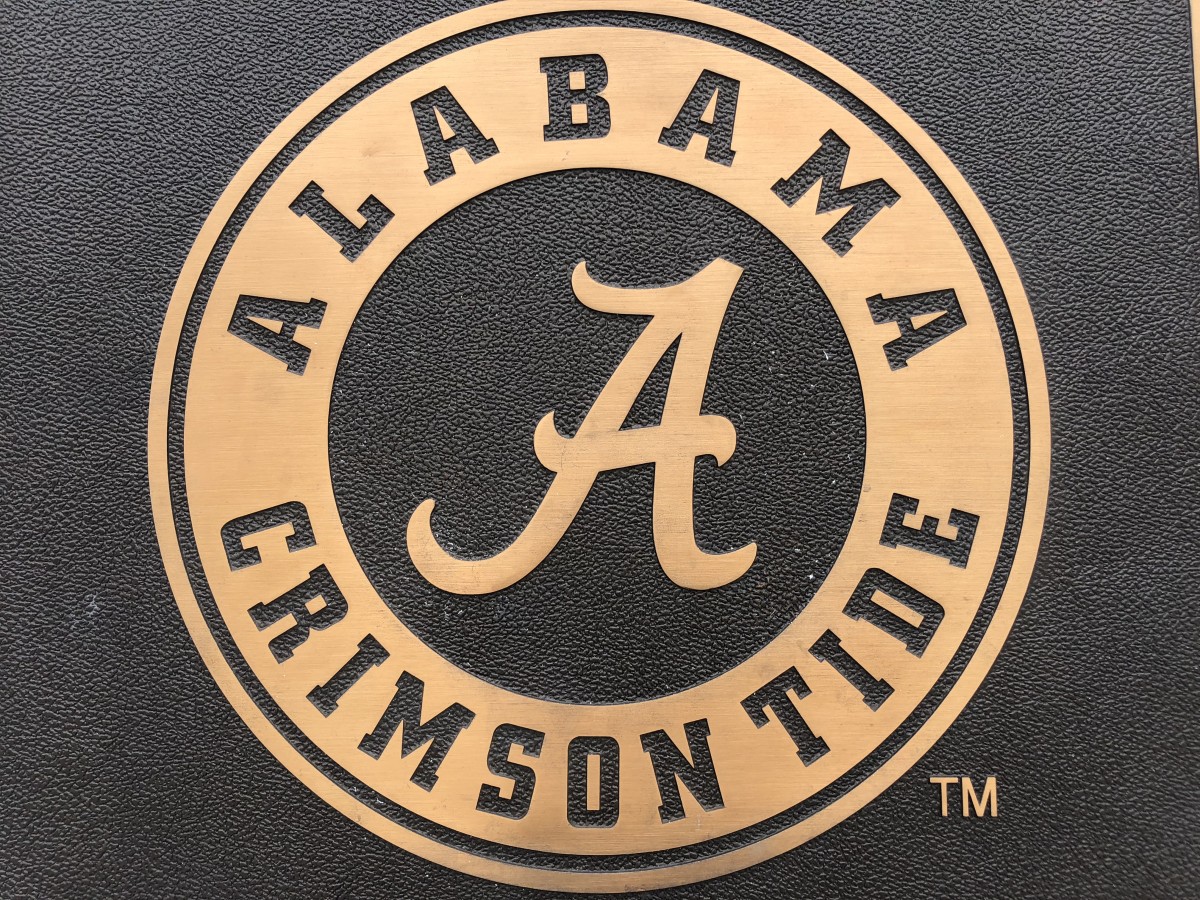 Alabama script A, gold with black background