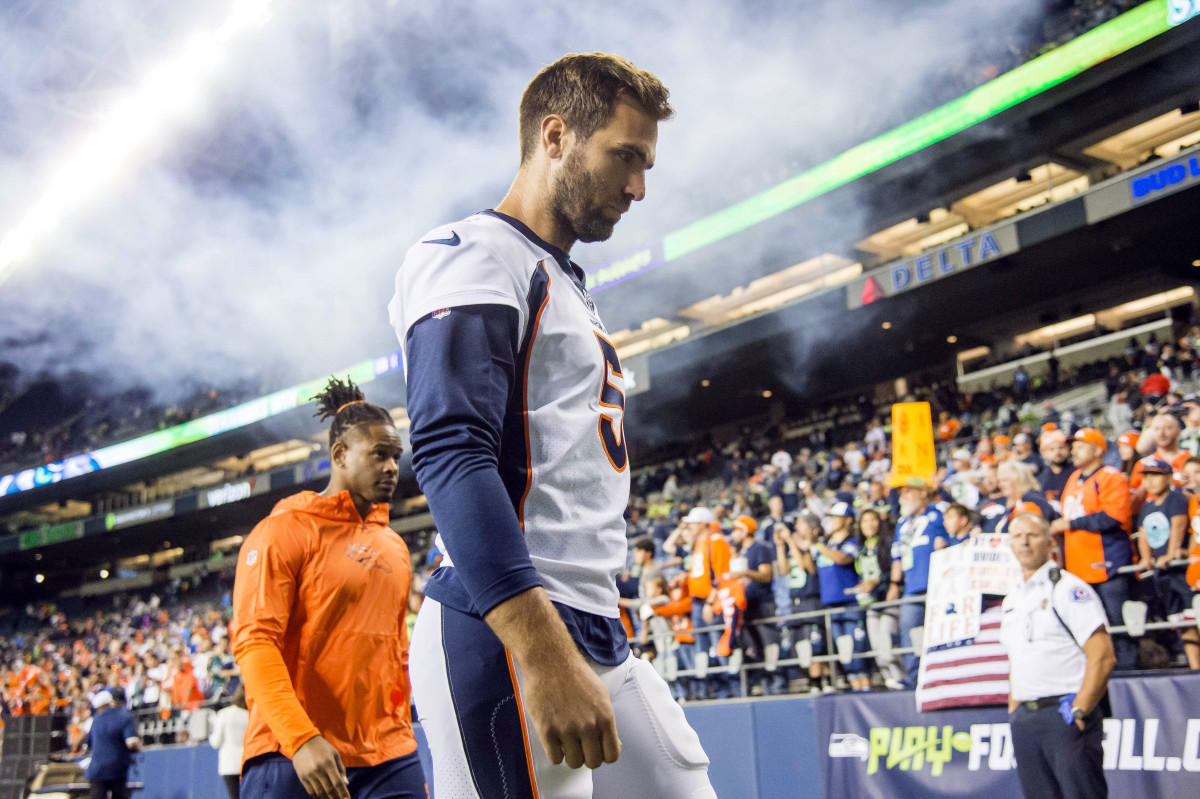 Denver Broncos quarterback Joe Flacco (5) walks off the field after a game against the Seattle Seahawks at CenturyLink Field. The Seahawks beat the Broncos 22-14.