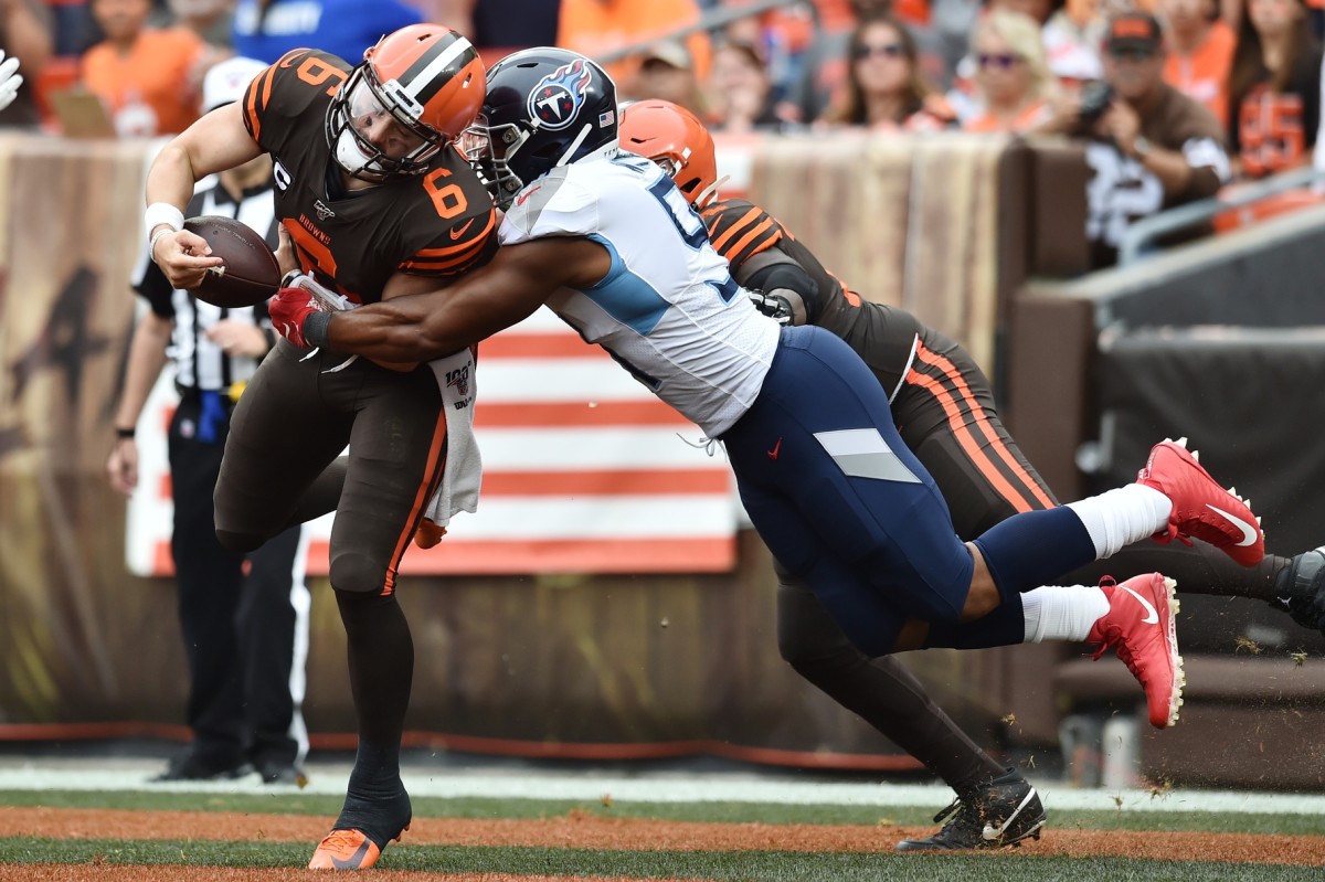Tennessee Titans linebacker Cameron Wake (91) sacks Cleveland Browns quarterback Baker Mayfield (6) in the end zone for a safety during the first half at FirstEnergy Stadium.
