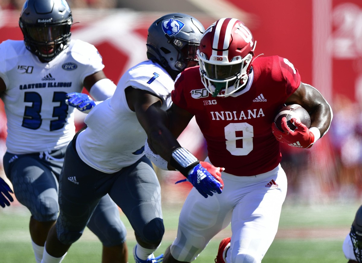 Indiana Hoosiers running back Stevie Scott III (8) gets tackled by Eastern Illinois Panthers safety Iziah Gulley (7) during the first quarter of the game at Memorial Stadium . Mandatory Credit: Marc Lebryk-USA TODAY Sports