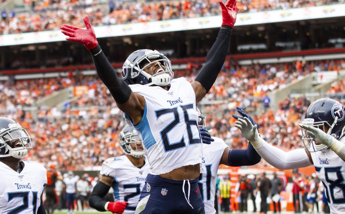 Tennessee Titans cornerback Logan Ryan (26) celebrates his interception against the Cleveland Browns during the fourth quarter at FirstEnergy Stadium.