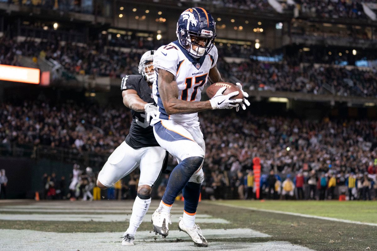 Denver Broncos wide receiver DaeSean Hamilton (17) catches a touchdown pass against Oakland Raiders strong safety Marcus Gilchrist (31) during the third quarter at Oakland Coliseum.