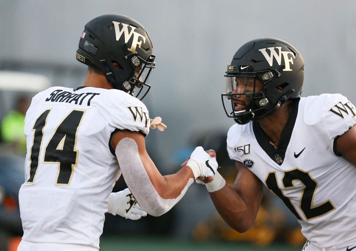 Sage Surratt and Jamie Newman celebrate during Wake Forest's win at Rice.