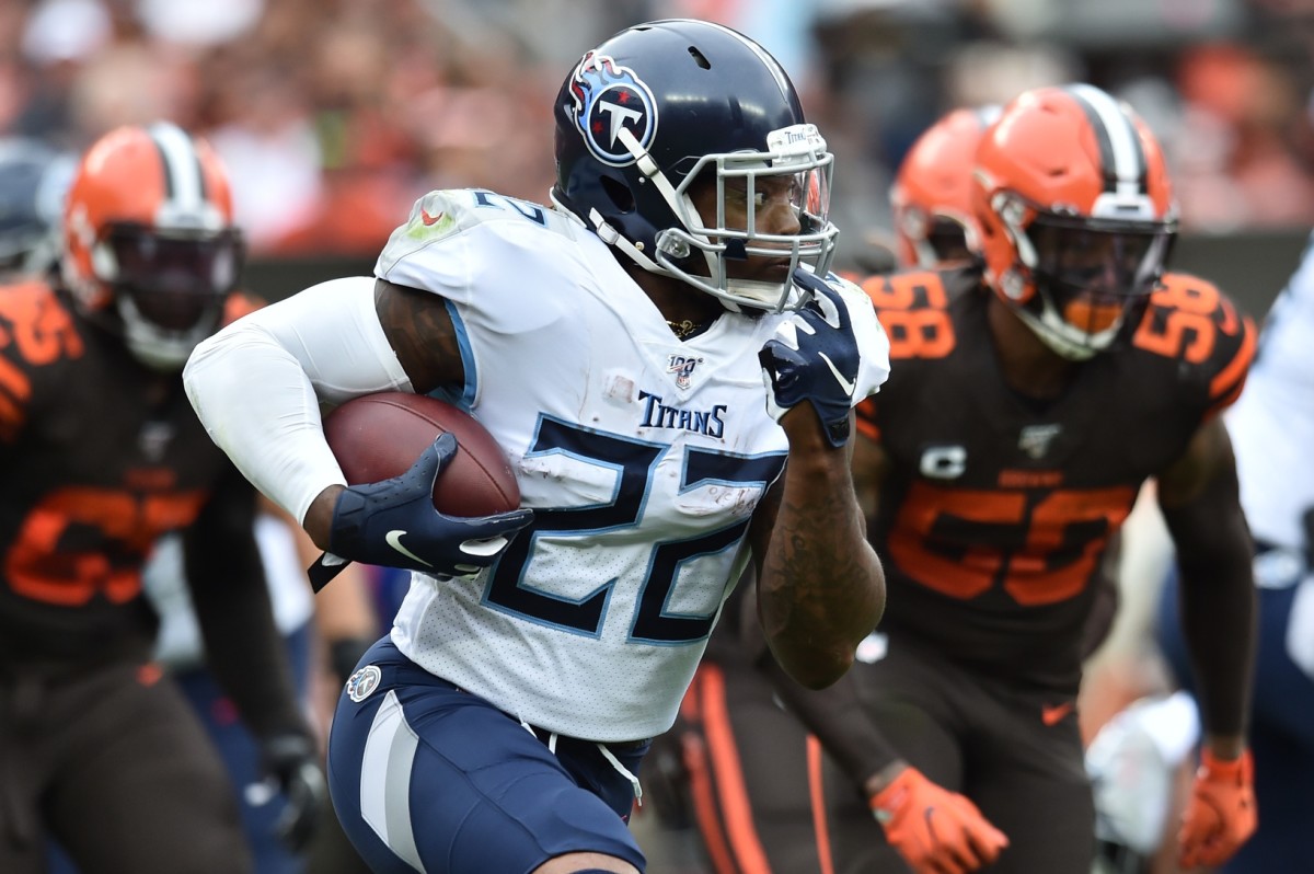 Tennessee Titans running back Derrick Henry (22) runs with the ball during the first half against the Cleveland Browns at FirstEnergy Stadium.