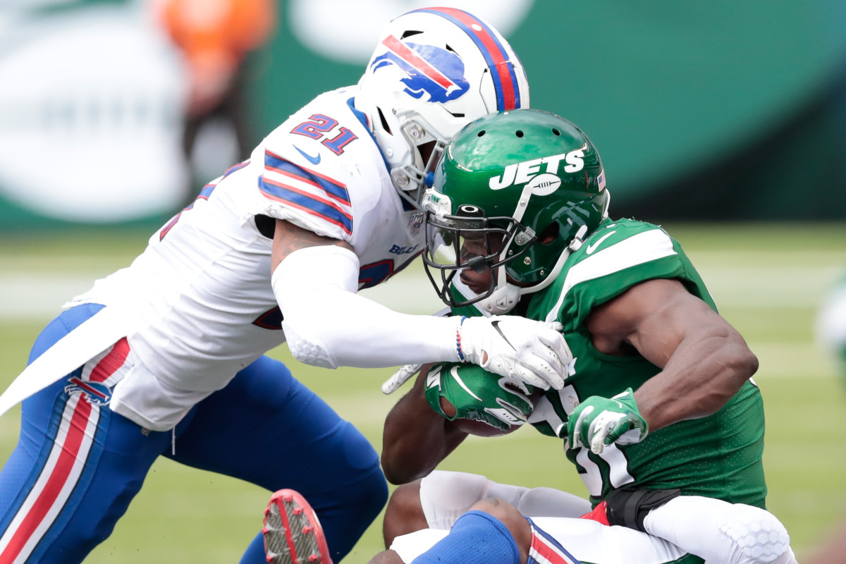 Sep 8, 2019; East Rutherford, NJ, USA; New York Jets wide receiver Quincy Enunwa (81) is tackled after a reception by Buffalo Bills free safety Jordan Poyer (21) during the second half at MetLife Stadium. Mandatory Credit: Vincent Carchietta-USA TODAY Sports