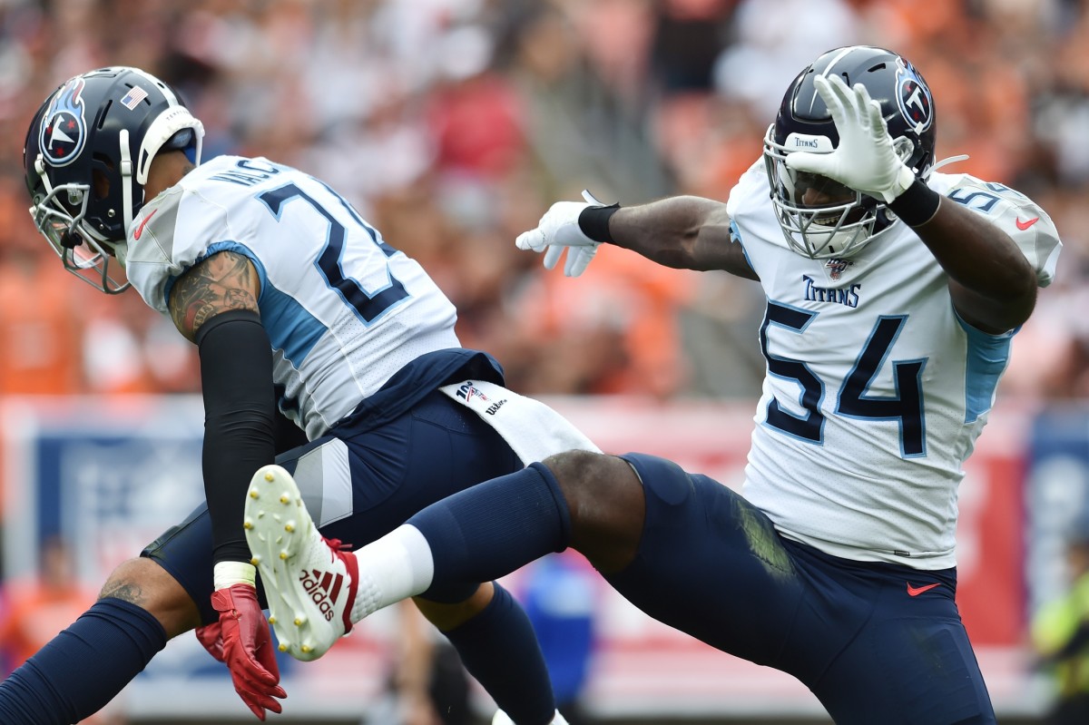 Tennessee Titans strong safety Kenny Vaccaro (24) and inside linebacker Rashaan Evans (54) celebrate after the Titans scored a safety during the first half against the Cleveland Browns at FirstEnergy Stadium.