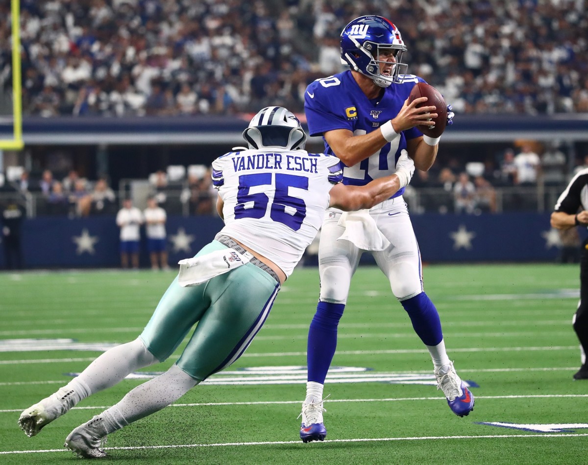 Sep 8, 2019; Arlington, TX, USA; New York Giants quarterback Eli Manning (10) is stopped on fourth down in the third quarter by Dallas Cowboys linebacker Leighton Vander Esch (55) at AT&T Stadium.