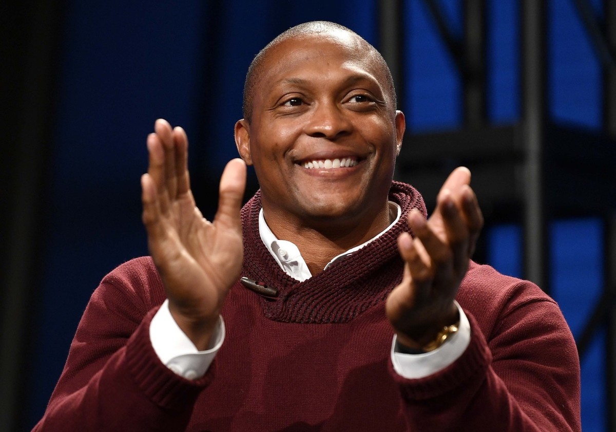 Tennessee Titans former player Eddie George applauds announcement of the new Major League Soccer franchise in Nashville at the Country Music Hall of Fame.