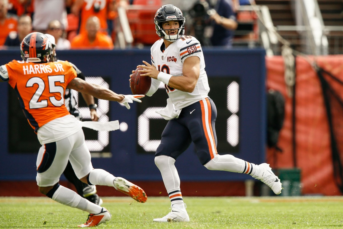 Chicago Bears quarterback Mitchell Trubisky (10) looks to pass as Denver Broncos cornerback Chris Harris Jr. (25) defends in the first quarter at Empower Field at Mile High.