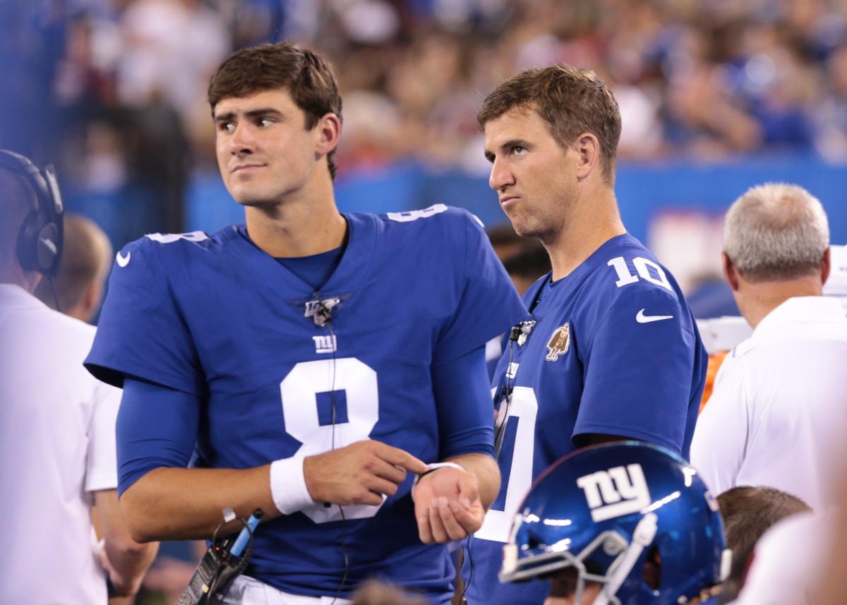 Aug 16, 2019; East Rutherford, NJ, USA; New York Giants quarterback Daniel Jones (8) looks on with quarterback Eli Manning (10) during the second half against the Chicago Bears at MetLife Stadium.