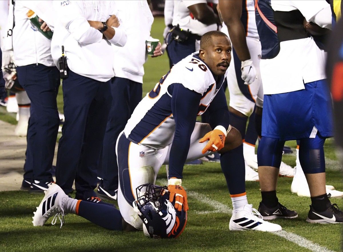 Denver Broncos outside linebacker Von Miller (58) kneels on the sideline between plays against the Oakland Raiders during the third quarter at Oakland Coliseum.