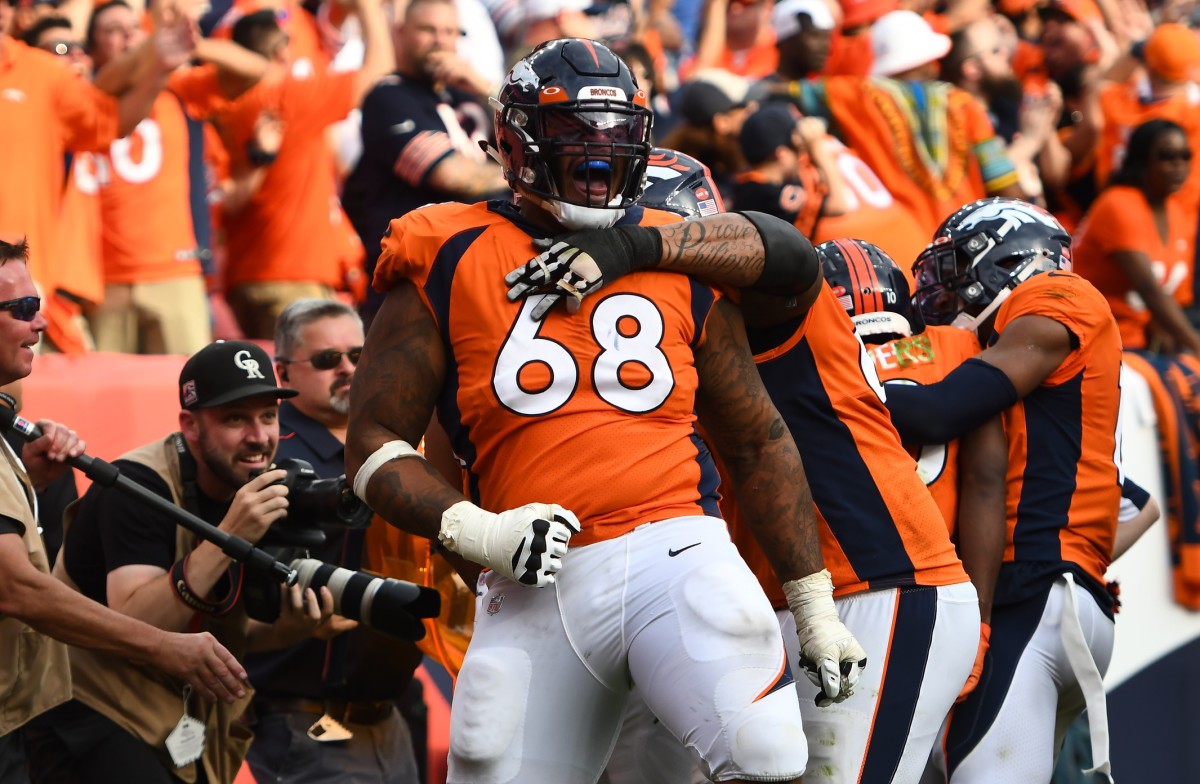 Denver Broncos offensive tackle Elijah Wilkinson (68) celebrates a touchdown score in the fourth quarter against the Chicago Bears at Empower Field at Mile High.