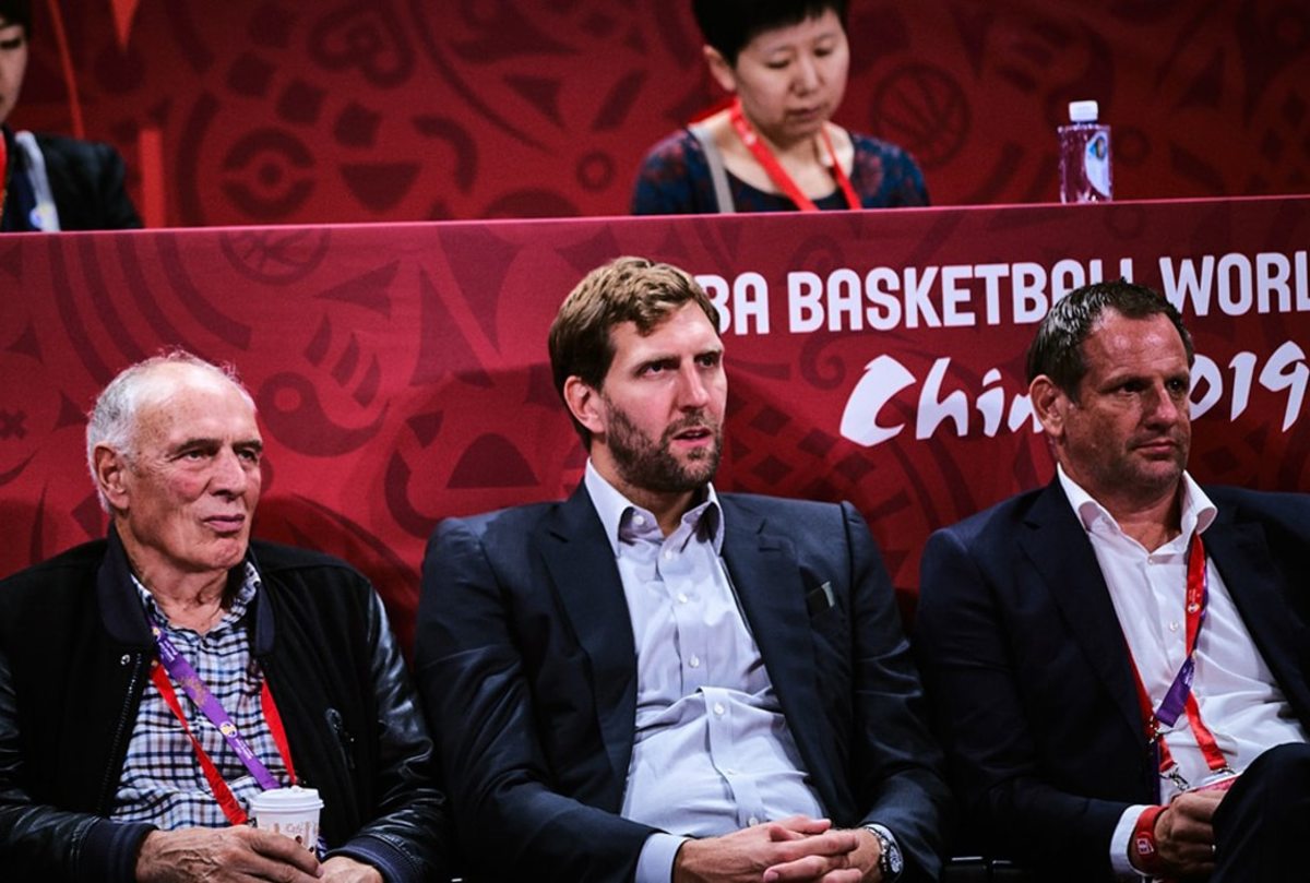 Dirk Nowitzki sitting with long-time mentor Holger Geschwindner at the 2019 FIBA World Cup.