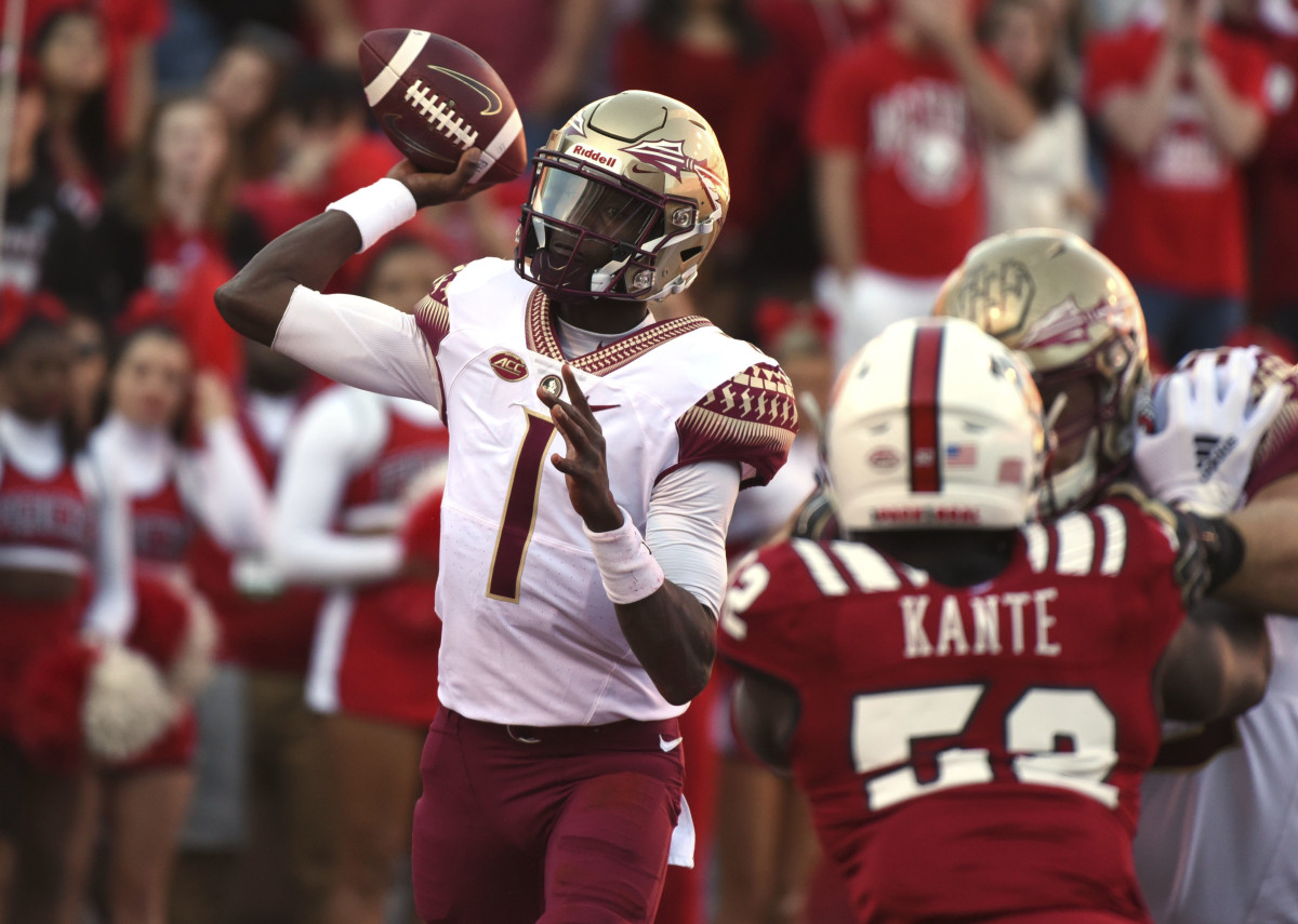 Florida State quarterback James Blackman throws under pressure from NC State's Ibrahim Kante during last year's game in Raleigh