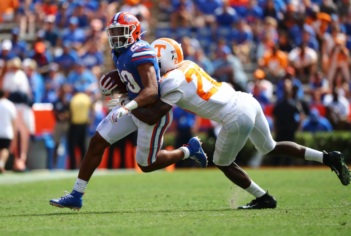 Sep 21, 2019; Gainesville, FL, USA; Florida Gators running back Malik Davis (20) runs with the ball as Tennessee Volunteers defensive back Theo Jackson (26) defends during the second half at Ben Hill Griffin Stadium. Mandatory Credit: Kim Klement-USA TODAY Sports